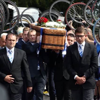 Cyclist perform a guard of honour with their bike wheels as the coffin of great-grandfather Don Lock arrives at Worthing Crematorium. PRESS ASSOCIATION Photo. Issue date: Wednesday August 12, 2015. Lock, a keen cyclist, was stabbed to death in an alleged road rage attack following a collision involving his car and another vehicle on the A24 at Findon, near Worthing, West Sussex, on July 16. See PA story FUNERAL Lock. Photo credit should read: Steve Parsons/PA Wire FUNERAL_Lock_152370.JPG