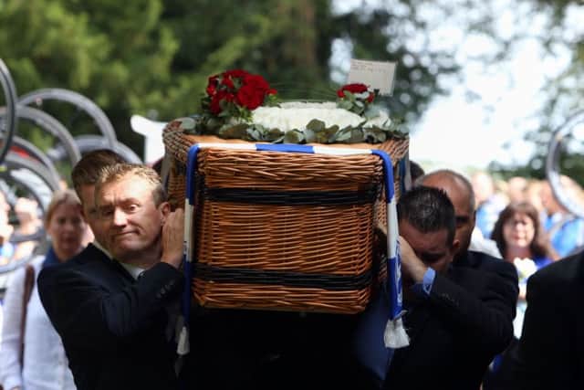 Cyclist perform a guard of honour with their bike wheels as the coffin of great-grandfather Don Lock arrives at Worthing Crematorium. PRESS ASSOCIATION Photo. Issue date: Wednesday August 12, 2015. Lock, a keen cyclist, was stabbed to death in an alleged road rage attack following a collision involving his car and another vehicle on the A24 at Findon, near Worthing, West Sussex, on July 16. See PA story FUNERAL Lock. Photo credit should read: Steve Parsons/PA Wire FUNERAL_Lock_152301.JPG