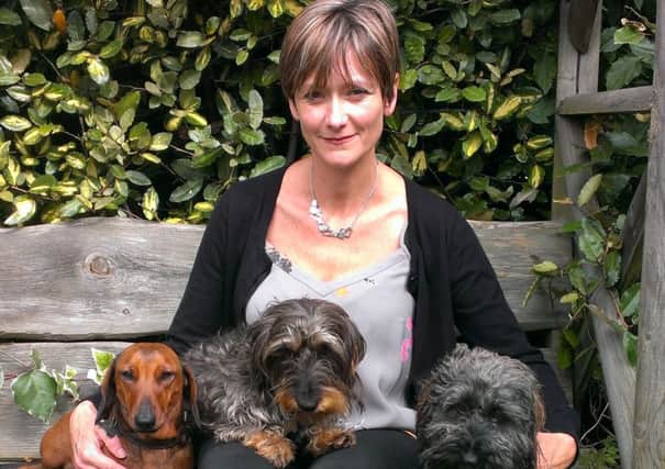 Penny Morris with her three dogs