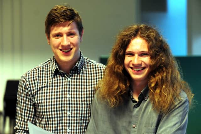 Twins James Shelton, 18, and his brother, Michael, both delighted by their results.ks1500371-2
