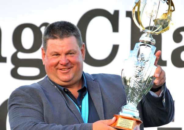 George Digweed clutches his latest World Championship trophy. Picture courtesy Double Barrelled Picture Co
