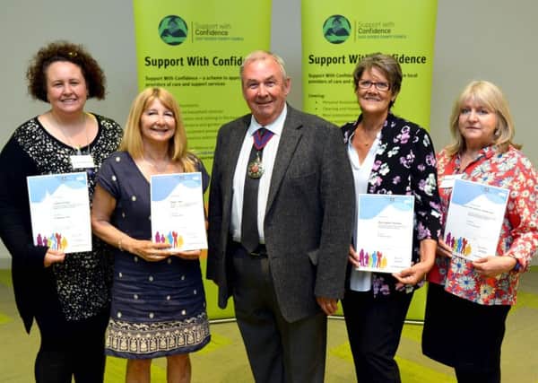 County council chairman cllr Colin Belsey joins the newest members of the Support with Confidence scheme