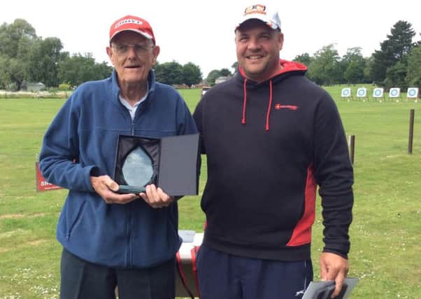 Stuart Champion presented honorary membership to club member John Chappell