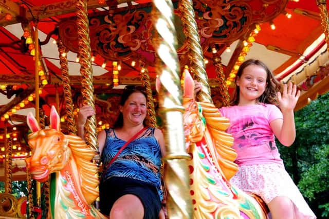 Claire Wyatt and her daughter Ella, eight, enjoying their ride ks1500380-5
