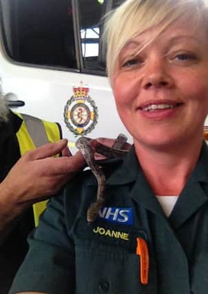 Paramedic Jo Dunstall with the snake intruder.