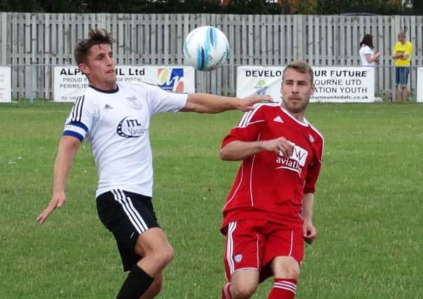 Bexhill United v Loxwood football action - FA Cup extra preliminary round, August 15, 2015 - Jack Aston (left) SUS-150818-234133002