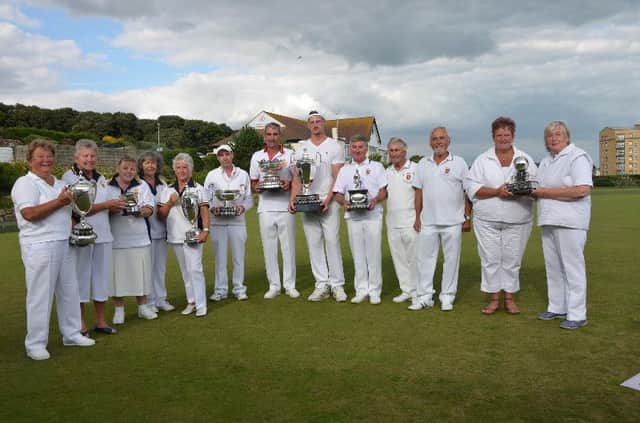 The Hastings Open Bowls Tournament winners proudly show off their trophies at White Rock Gardens