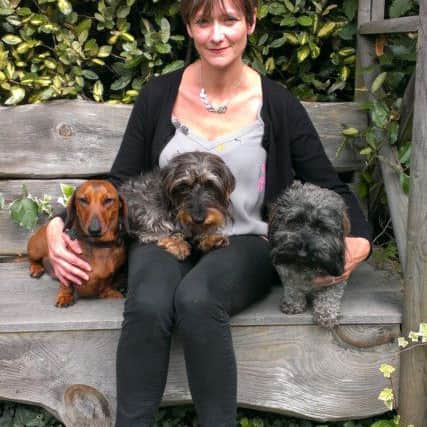 Penny Morris with her three dogs SUS-150819-104717001