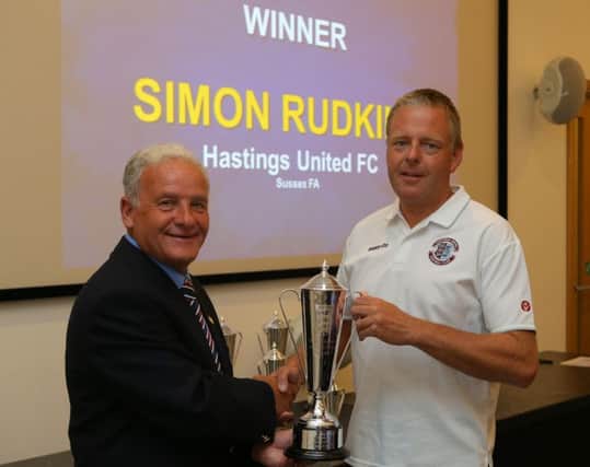 Simon Rudkins receives his award from the vice-chairman of the FA Facilities Committee, Geoff Turrell, at St George's Park. Photo by Dave Thompson - The FA/Getty Images