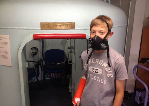 Thomas Strudwick outside the hyperbaric oxygen chamber