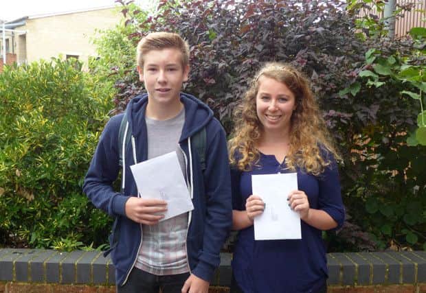 High achievers Sam Dallas and Emily Batchelor celebrate their results at Tanbridge House