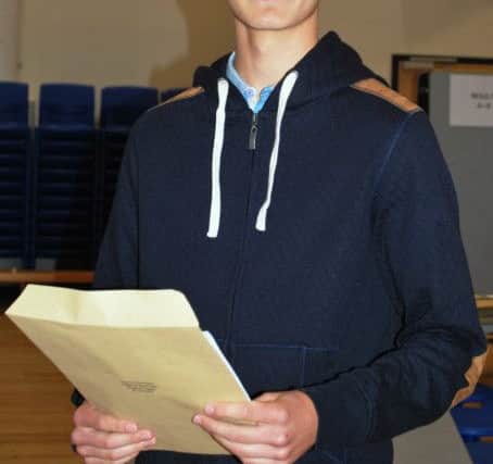 Successful GCSE student Connor Gormley with his results at The Regis School SUS-150820-130406001
