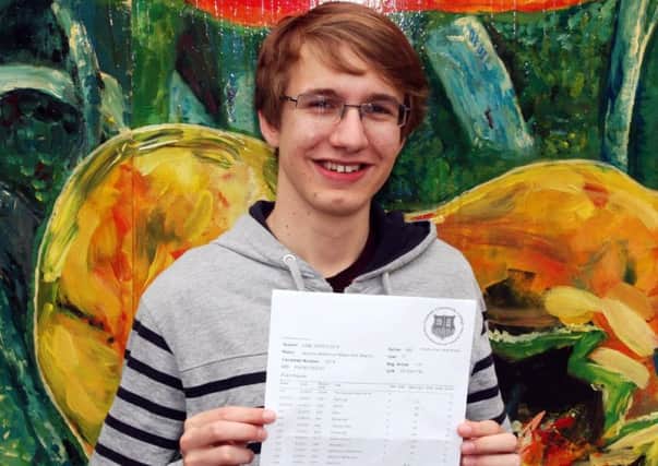 Martin Smit with his GCSE results at Felpham Community College SUS-150820-135121001