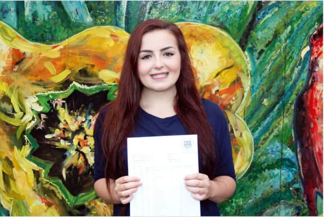 Felpham Community College student Hannah Merriman with her GCSE results of 9A* and 2 A grades SUS-150820-134634001