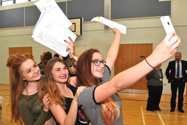 Hold on, let me take a selfie: Sophie Coombes, Tia Hodson and Temisis Conway take a photo together with their results   PHOTO: Stephen Goodger  SGTLA3