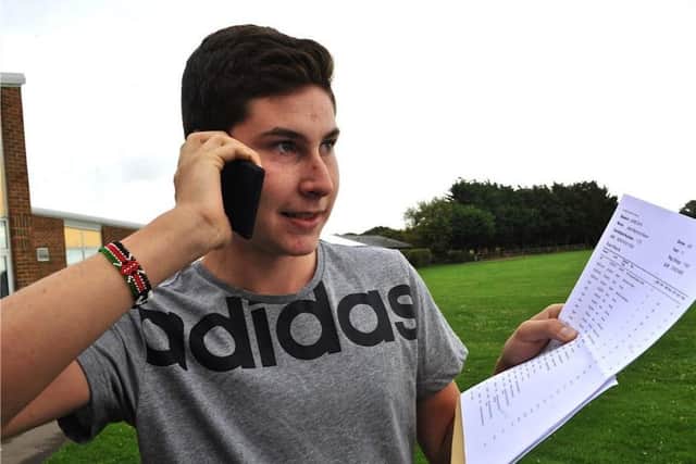 Jake Melvin calls home to tell his family about his GCSE marks  PHOTO: Stephen Goodger  SGTAS2