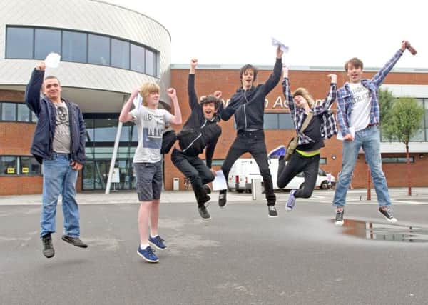 Students jumping for joy at Shoreham Academy DM155515a