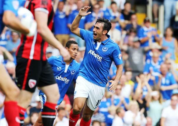 Gary Roberts scored twice as 10-man Pompey earned a point after falling 3-0 behind to visitors Morecambe   Picture: Joe Pepler