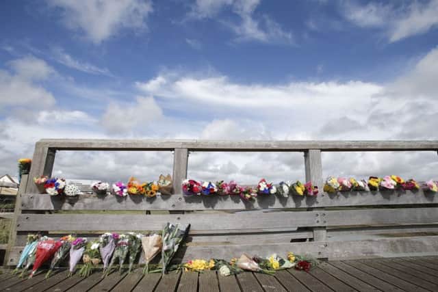 People have been laying flowers on the Shoreham Tollbridge since the accident. PA Pic