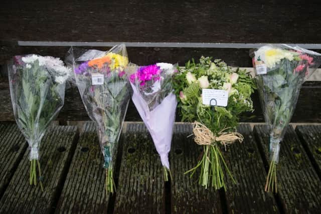 Flowers laid on the Shoreham Tollbridge that crosses the River Adur near the site where seven people died when an historic Hawker Hunter fighter jet plummeted on to the A27 at Shoreham in West Sussex after failing to pull out of a loop manoeuvre. PRESS ASSOCIATION Photo. Picture date: Sunday August 23, 2015. More bodies may be found as investigators and emergency services continue to search the scene of the Shoreham Airshow plane crash, police said. Photo: Daniel Leal-Olivas/PA Wire