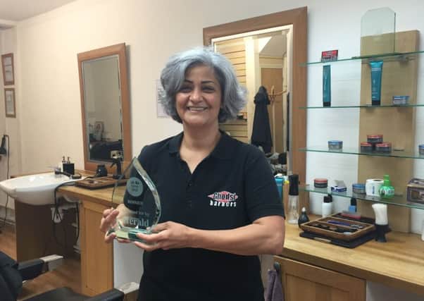 Ghodsi Young with the Salon of the Year trophy, presented at her barbers in Warwick Street, Worthing