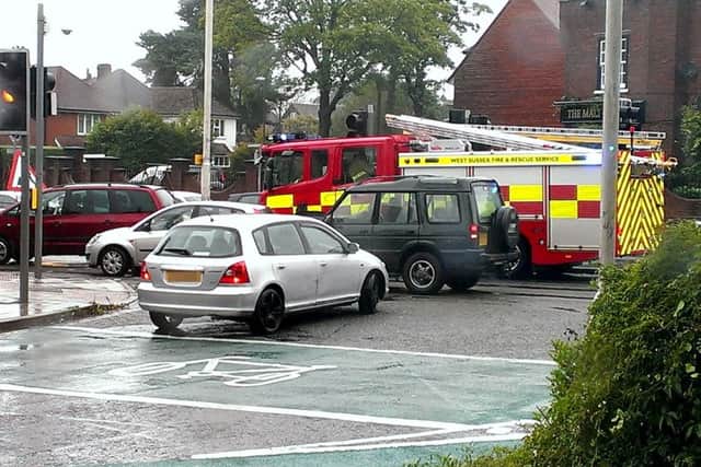 Fire appliance stuck in road works traffic in Horsham. Pic Steve Robards   SR1520699 SUS-150825-165148001