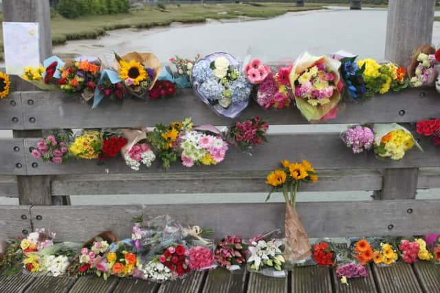 DM157412a.jpg Floral tributes on footbridge near Shoreham Airport following the plane crash. Photo by Derek Martin SUS-150824-194858008