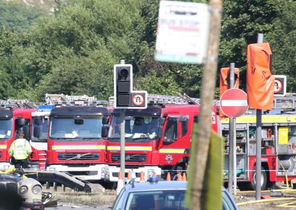 Two officers have resigned after acting inappropriately at the Shoreham Airshow crash site
