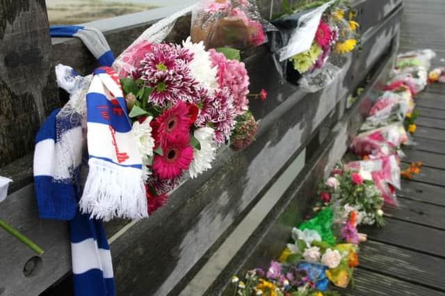 Floral tributes on the Old Tollbridge near Shoreham Airport