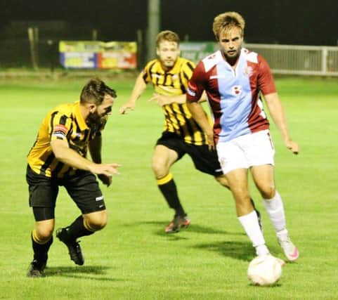 Zac Attwood on the ball for Hastings United against Folkestone Invicta. Picture courtesy Joe Knight (SUS-150827-084817002)