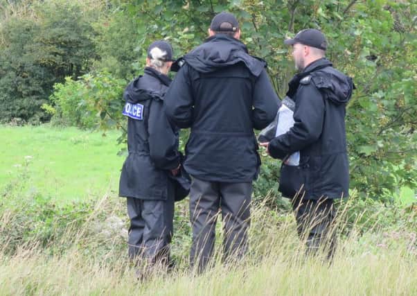 Police officers at the Shoreham air crash site