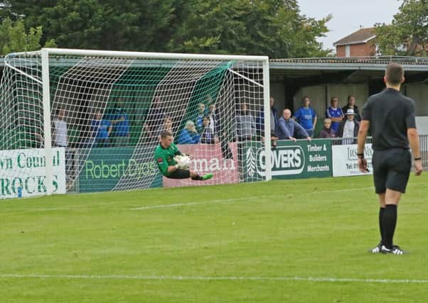 Grant Smith saves Billericay's penalty / Picture by Tim Hale