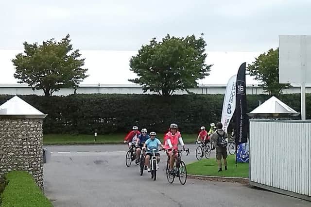 The girls returning to the Goodwood motor circuit after completing the 12 mile sportive