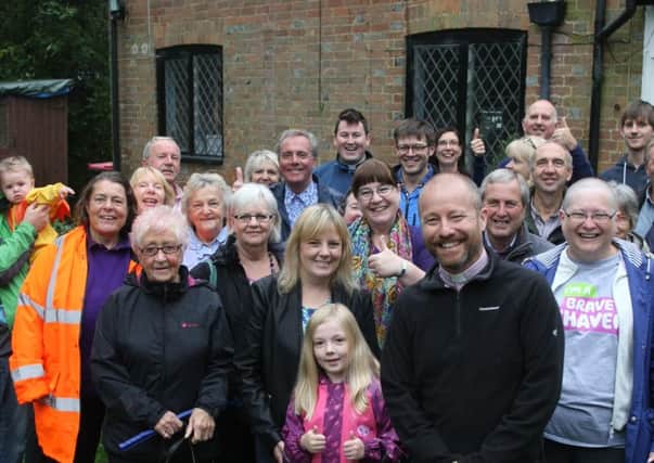 DM159321a.jpg Ifield community backs planning bid for church owned listed building. The reverend Simon Newham is in front. Photo by Derek Martin SUS-150831-210756008