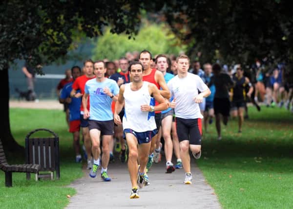 JPCT 050914 S14380377x First-ever Horsham park run, 5k event in Horsham Park. Runners start, using public footpaths around the park -photo by Steve Cobb SUS-140909-103334001