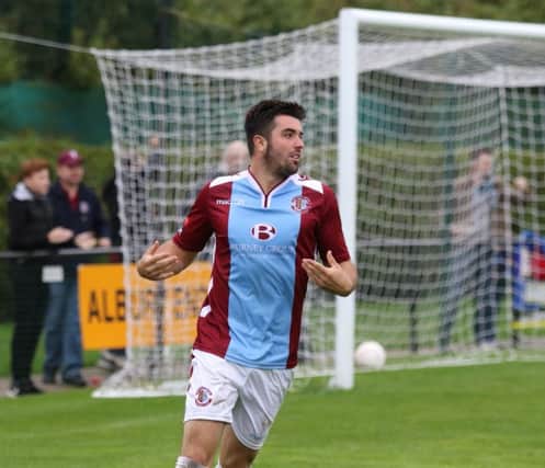 Sam Cole celebrates after putting Hastings United ahead against Walton Casuals on Monday. Picture courtesy Scott White