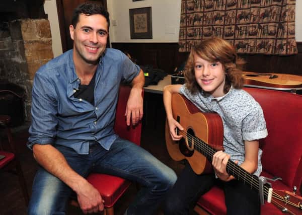 24/10/14- Keane's Tim Rice-Oxley gives advice and guidance to Will Pollard- part of Battle Festival.  Will Pollard is the grandson of popular local man Derek Norcross. SUS-141031-100224001