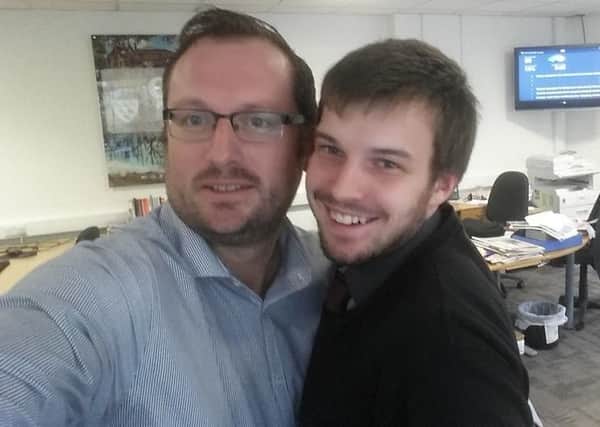 Reporter James Oxenham with boss Mark Dunford at the West Sussex County TImes office in Horsham take a quick selfie for national Hug Your Boss day.