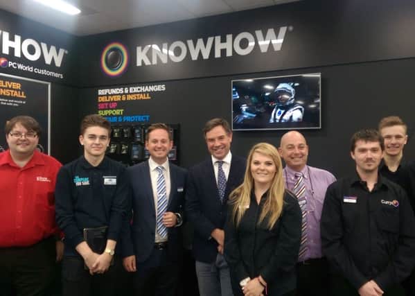 Horsham MP Jeremy Quin with staff at the new-look Currys PC World store in Horsham.