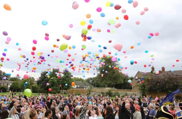 Balloons are released in Worthing in memory of Mark Trussler, who died in the Shoreham Airshow disaster SUS-150509-154536001