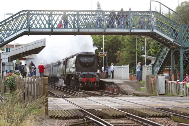 The Battle of Britain Class Pacific 34067 Tangmere steam engine passes through Goring station. Picture by Eddie Mitchell SUS-150509-111729001