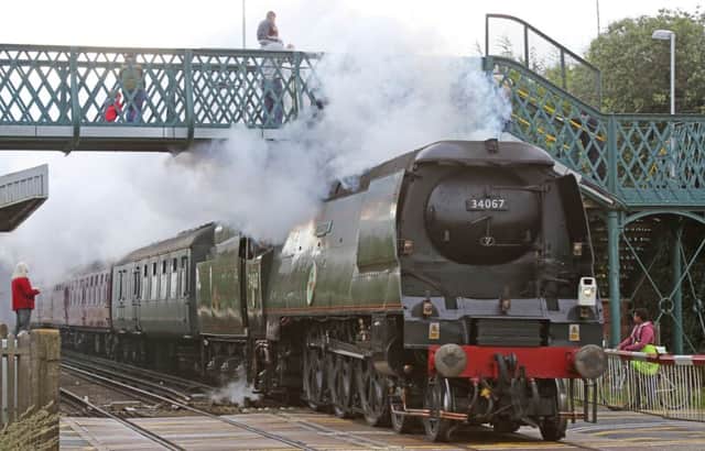 The Battle of Britain Class Pacific 34067 Tangmere steam engine passes through Goring station. Picture by Eddie Mitchell SUS-150509-111740001