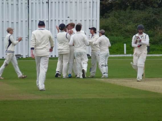 Hastings Priory celebrate after taking the final wicket against Crowhurst Park. Picture by Simon Newstead (SUS-150609-135814002)