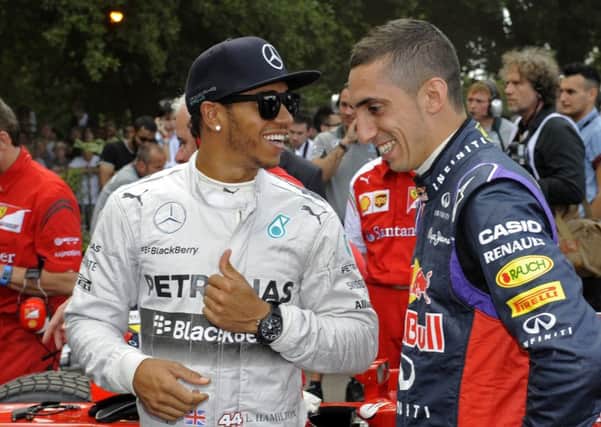 Lewis Hamilton, left, at Goodwood's Festival of Speed in 2014. Picture by Malcolm Wells
