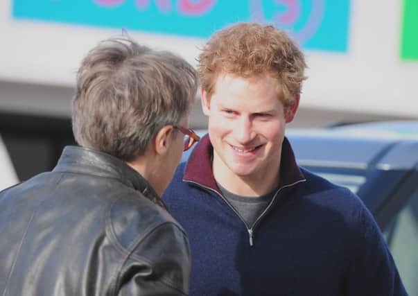 Prince Harry chats to Lord March during his visit to Goodwood in 2014.Picture by Kate Shemilt