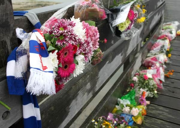 Floral tributes on footbridge near Shoreham Airport following the plane crash. Photo by Derek Martin