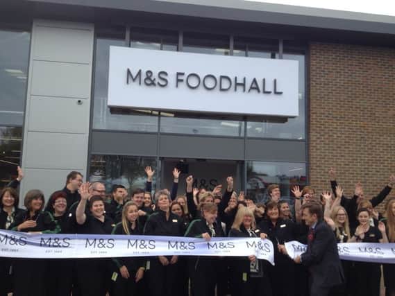 The new Marks and Spencer Foodhall is opened in Bognor Regis as manager Steve Lake cuts the ribbon