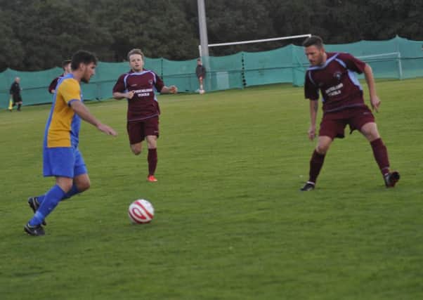 Action from Little Common's 3-2 victory at home to Bexhill United on Wednesday night. Picture by Simon Newstead