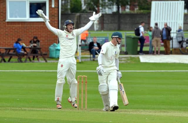 Bexhill batsman Ethan Guest looks on as Eastbourne wicketkeeper Callum Jackson appeals last weekend. Picture by Peter Cripps (SUS-150709-000634008)