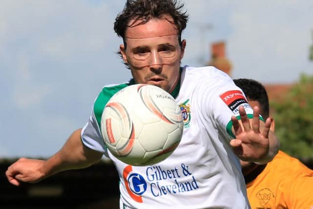 Gary Charman - who later got the winner - gets a shot in for the Rocks v Merstham / Picture by Chris Hatton